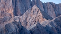 Rugged rocky mountain peaks and ridges under a clear sky