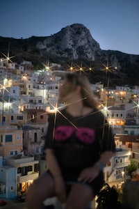 Woman striking an OOF pose in Menetes village, Karpathos, Greece. July 2026.